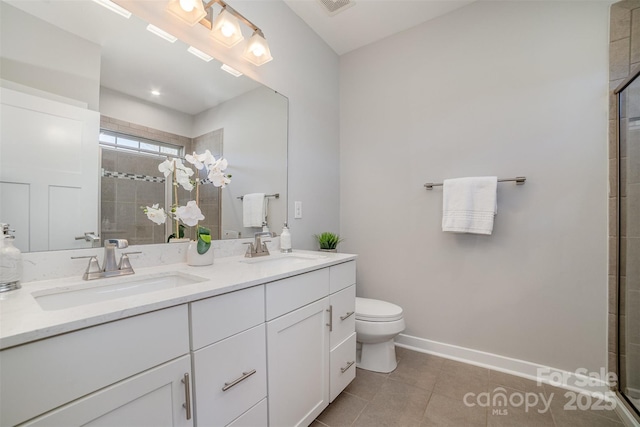 full bathroom featuring tile patterned flooring, baseboards, a sink, and tiled shower