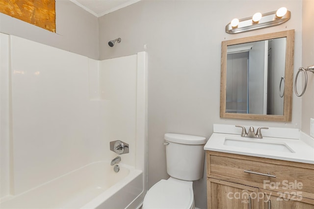 bathroom featuring toilet, bathtub / shower combination, ornamental molding, and vanity