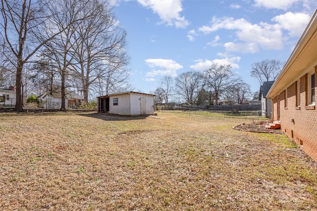 view of yard featuring a fenced backyard and an outdoor structure