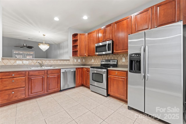 kitchen with decorative backsplash, stainless steel appliances, light countertops, open shelves, and a sink