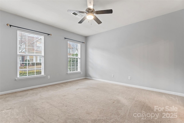 unfurnished room featuring ceiling fan, carpet flooring, and baseboards