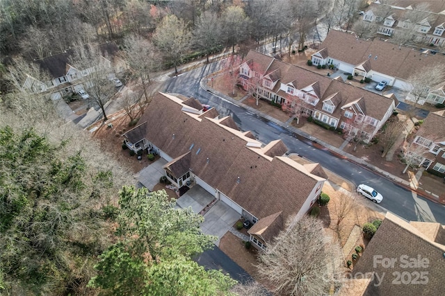 birds eye view of property with a residential view