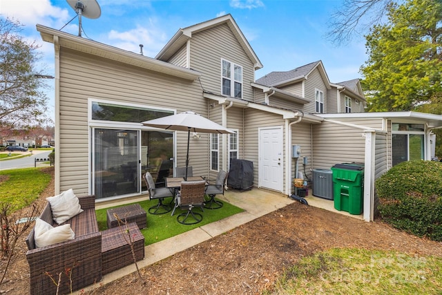 back of property featuring central AC and a patio