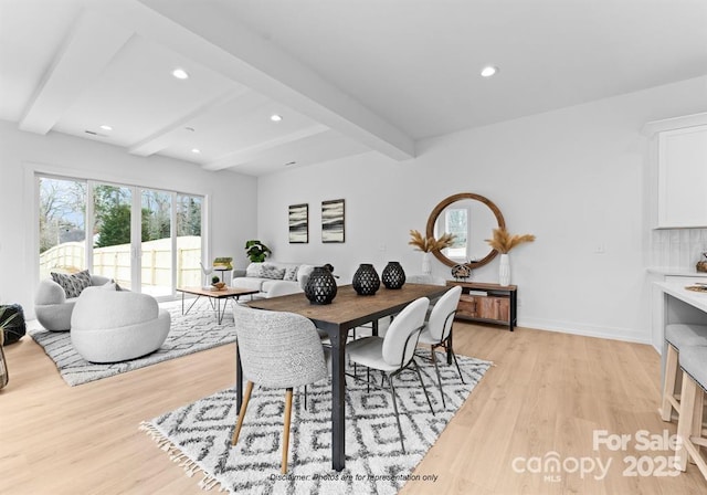 dining space featuring light wood-style floors, baseboards, beam ceiling, and recessed lighting