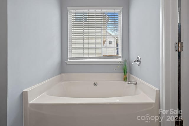 bathroom featuring a garden tub