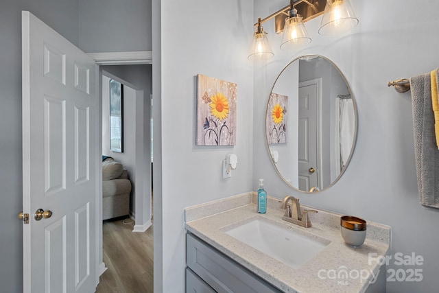 full bath with vanity and wood finished floors