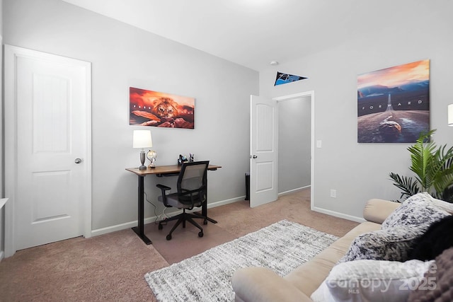 carpeted office featuring baseboards