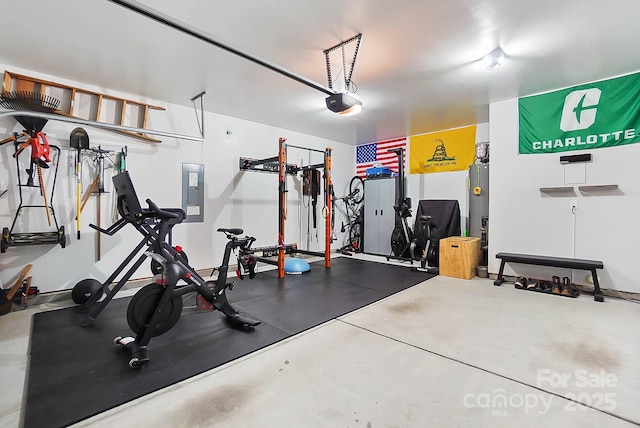 workout room featuring electric panel and a garage