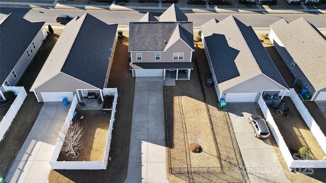 birds eye view of property with a residential view