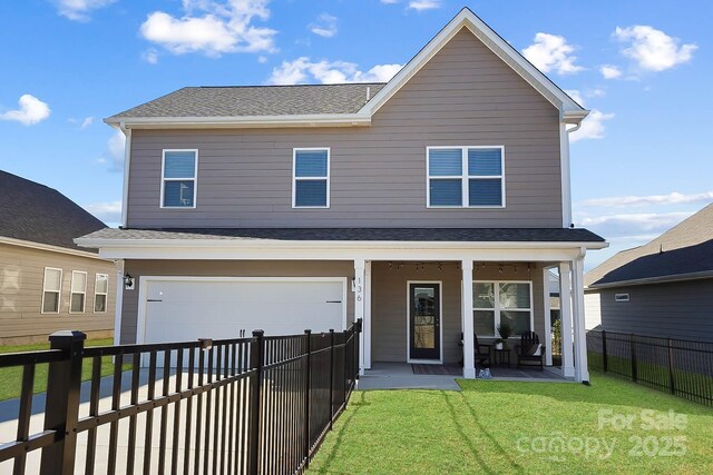 136 Kingston Dr, Locust, NC 28097 - traditional home with a porch, a garage, driveway, and a shingled roof