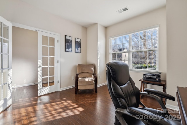 office area featuring wood-type flooring, visible vents, baseboards, and french doors