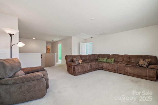 carpeted living room with recessed lighting