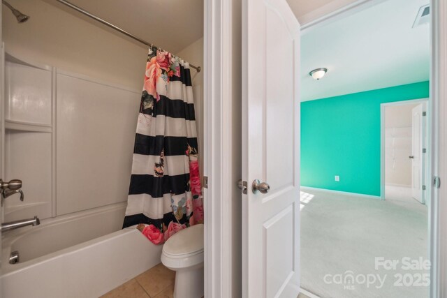 full bath with toilet, shower / bathtub combination with curtain, visible vents, and tile patterned floors