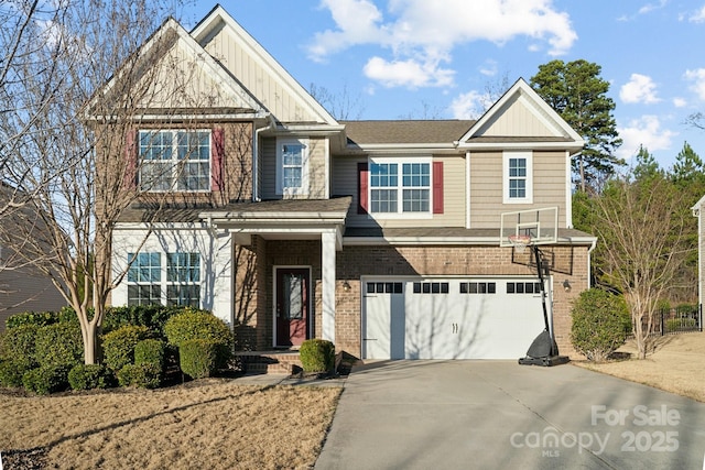 craftsman-style home featuring driveway, an attached garage, board and batten siding, and brick siding