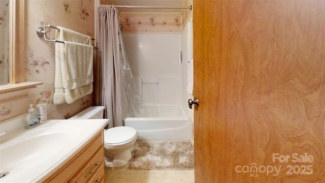 bathroom featuring shower / tub combo with curtain, vanity, and toilet