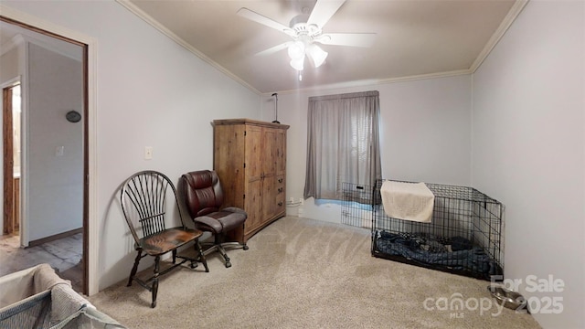 living area featuring light carpet, ceiling fan, and crown molding