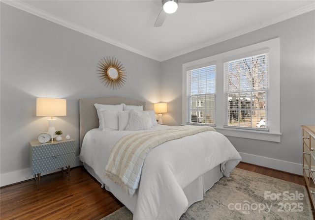 bedroom with ornamental molding, a ceiling fan, baseboards, and wood finished floors