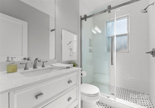 full bathroom featuring ornamental molding, a stall shower, vanity, and toilet