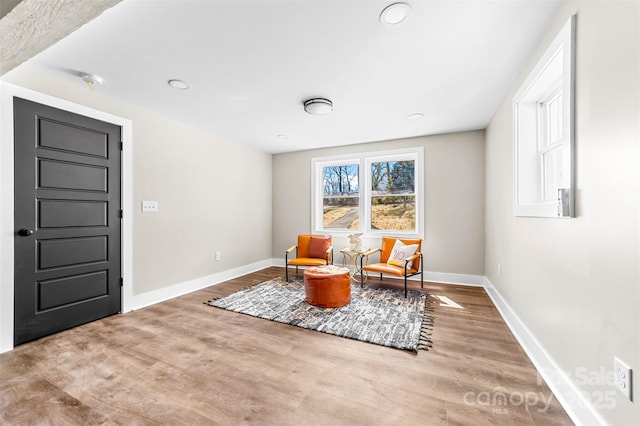 sitting room featuring wood finished floors and baseboards