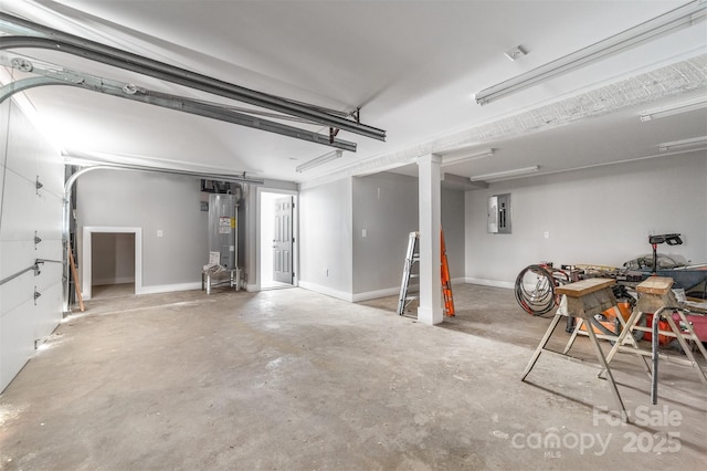 garage featuring electric panel, water heater, and baseboards