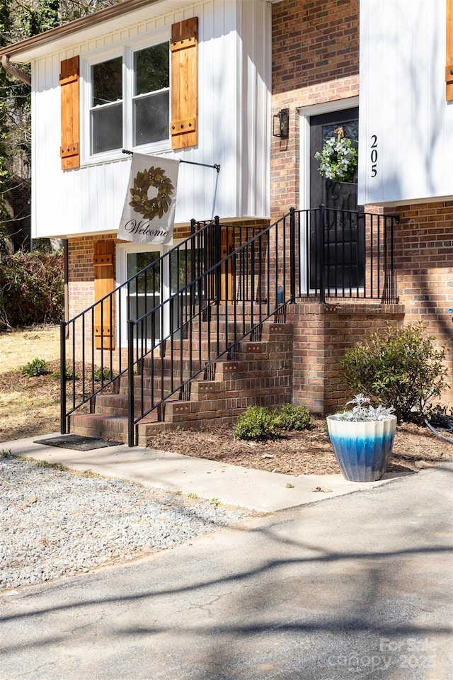 entrance to property with brick siding