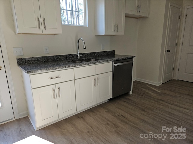 kitchen featuring dark wood-style floors, white cabinets, a sink, dark stone countertops, and dishwasher