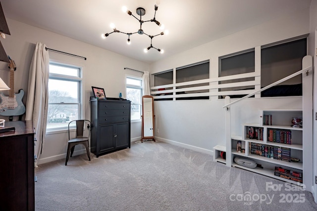 bedroom featuring carpet floors, a chandelier, and baseboards