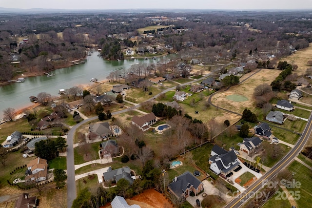 birds eye view of property featuring a residential view and a water view