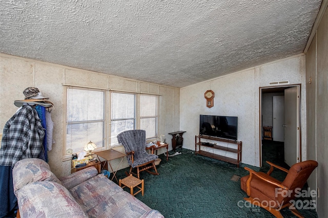 living area with lofted ceiling, carpet, visible vents, and a textured ceiling