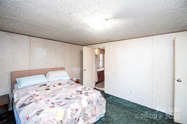 carpeted bedroom with a textured ceiling