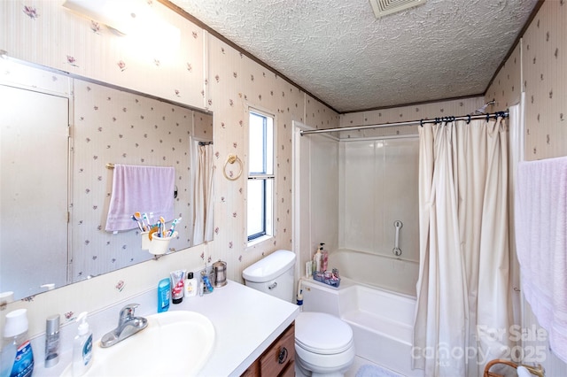 bathroom featuring toilet, shower / bath combo, vanity, a textured ceiling, and wallpapered walls