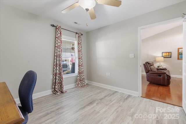 office with visible vents, a ceiling fan, baseboards, and wood finished floors