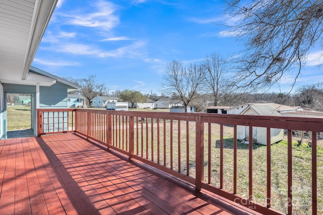 wooden terrace featuring a residential view