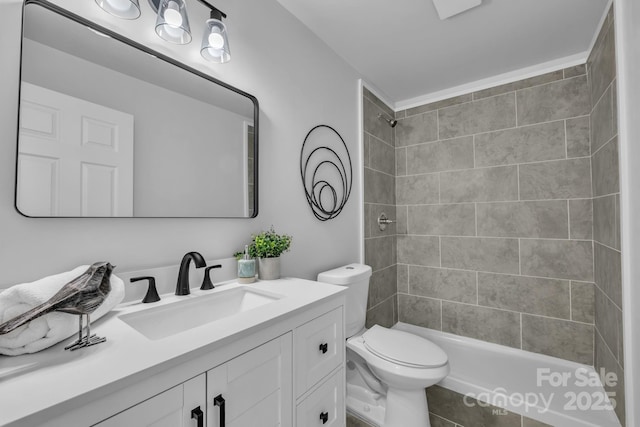 full bathroom with tiled shower, vanity, toilet, and tile patterned floors