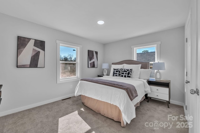 bedroom with visible vents, baseboards, and carpet flooring