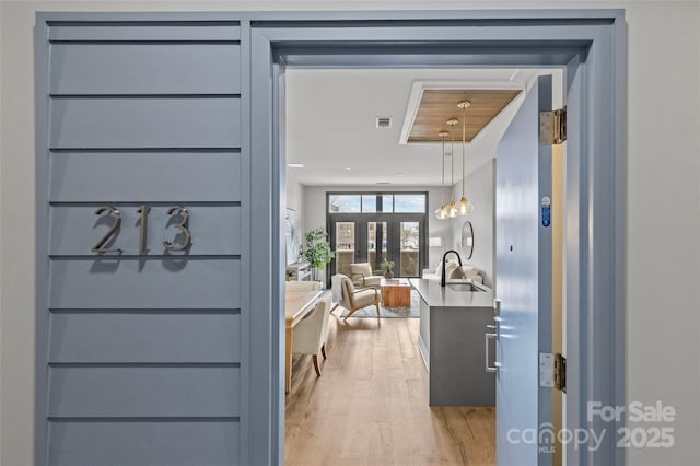 interior space featuring visible vents and light wood finished floors