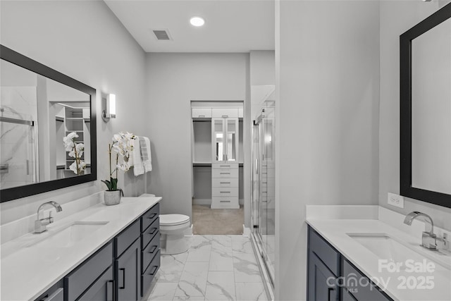 full bath featuring a stall shower, visible vents, and a sink