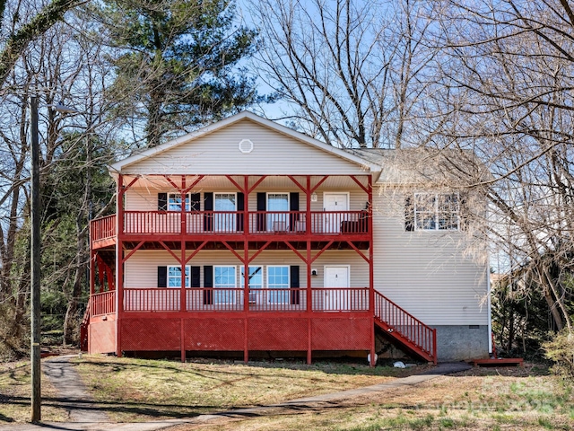 rear view of house featuring crawl space