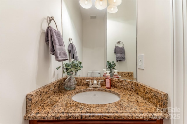 bathroom featuring visible vents and vanity