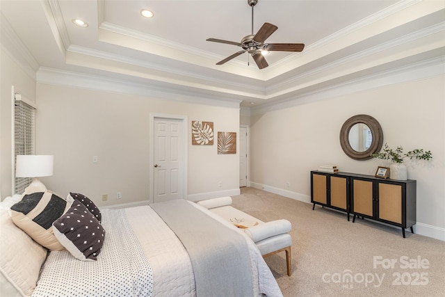 bedroom featuring a tray ceiling, ornamental molding, and light colored carpet