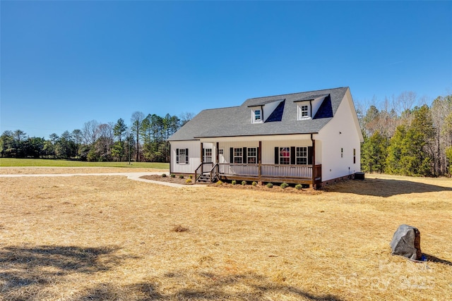 modern farmhouse with a front yard and roof with shingles