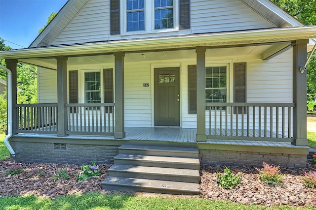 bungalow-style home with covered porch and crawl space