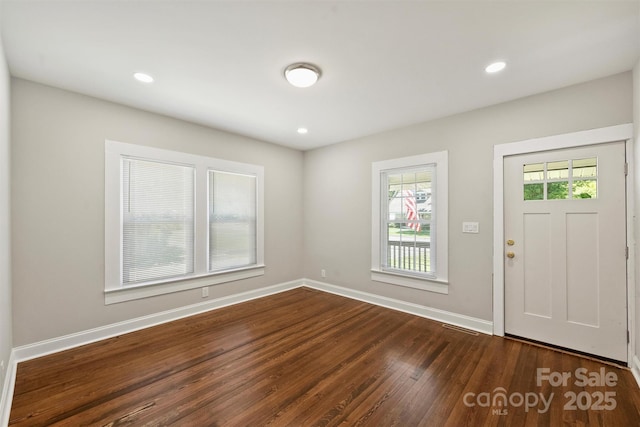 entrance foyer featuring baseboards, dark wood-type flooring, and recessed lighting