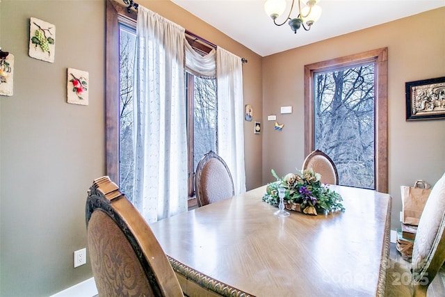 dining room with a notable chandelier