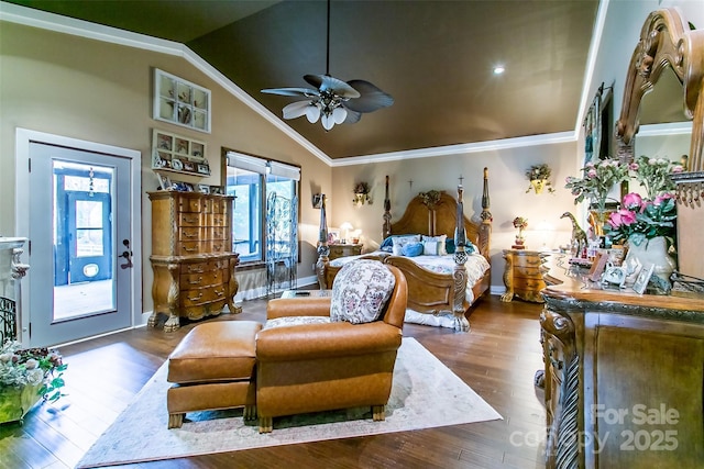 bedroom with vaulted ceiling, baseboards, wood finished floors, and crown molding