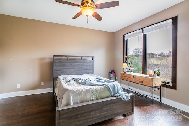 bedroom with ceiling fan, baseboards, and hardwood / wood-style floors