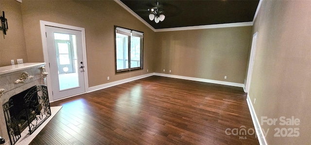 5 N Valley Dr, Weaverville, NC 28787 - unfurnished living room featuring ornamental molding, vaulted ceiling, ceiling fan, dark wood finished floors, and a fireplace