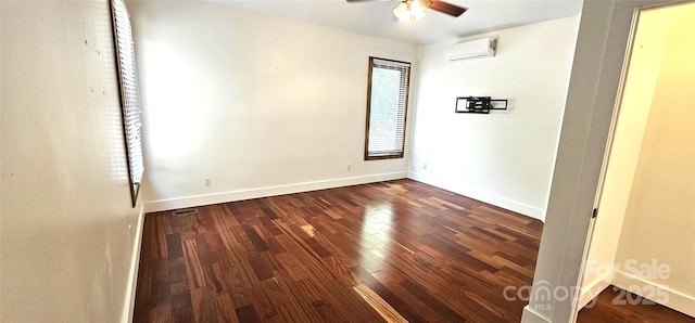 5 N Valley Dr, Weaverville, NC 28787 - unfurnished bedroom featuring an AC wall unit, wood finished floors, baseboards, and ceiling fan