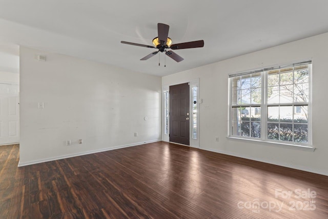 foyer featuring wood finished floors, a ceiling fan, and baseboards