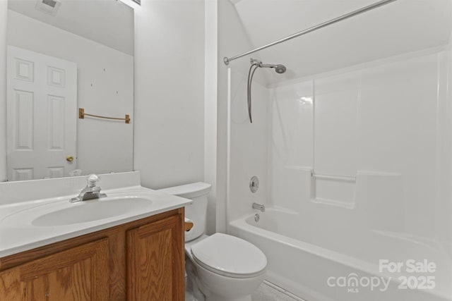 bathroom featuring toilet, washtub / shower combination, visible vents, and vanity